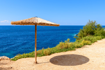 Umbrella on Porto Limnionas beach on Zakynthos island, Greece