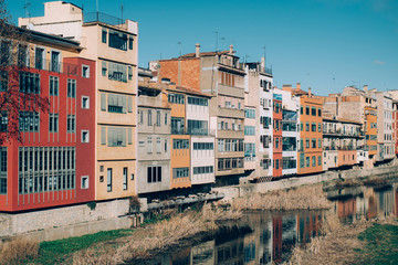 Fototapeta na wymiar View of Girona with its picturesque river houses in a sunny day.