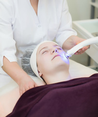 Obraz na płótnie Canvas Cosmetology, face laser procedures.