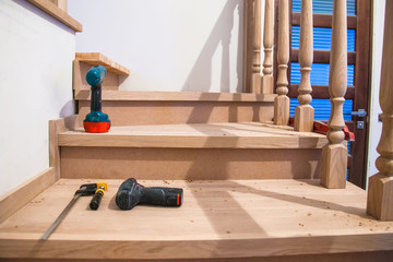 Manufacturing, repair of wooden stairs in a residential building.