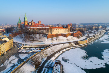 Wawel Castle, Cathedral and partly frozen Vistula river in winter. Krakow, Poland. Aerial skyline...