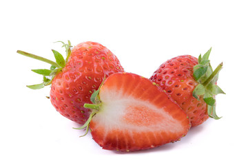 Perfectly retouched fresh strawberry fruit with sliced half isolated on white background. One of the best isolated strawberries you have seen. Selective focus