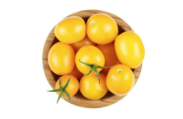 yellow tomatoes in a plate isolated