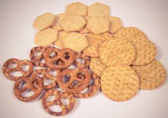 Mix of snacks : pretzels, crackers, cookies.