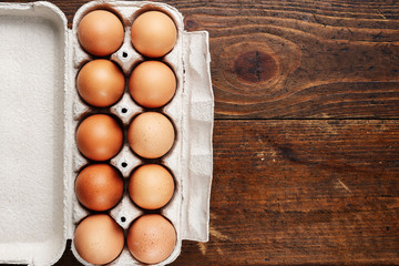 chicken eggs on a wooden background