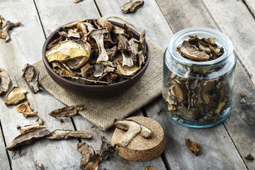 dried mushrooms on a wooden background