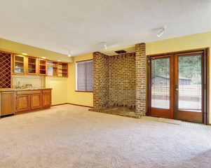 Empty family room interior with soft yellow walls