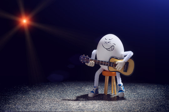 Egg rocker guitarist with acoustic guitar