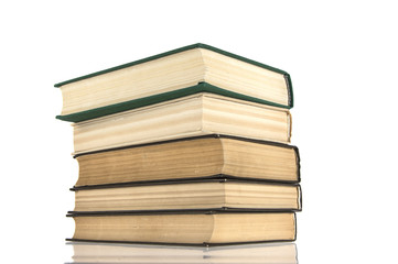 stack of old books on white isolated background