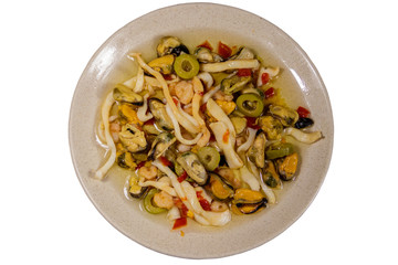 Seafood salad with shrimp, squid and mussels isolated on white background 
