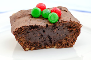 Chocolate brownie with decorative balls - macro