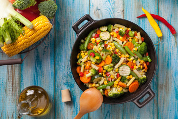 Mix of vegetables fried in a wok.