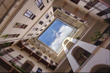 wide view of house and square exit to the sky.