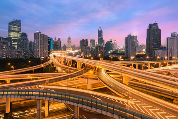 Fototapeta na wymiar Beautiful Shanghai city with interchange overpass at nightfall in Shanghai, China.