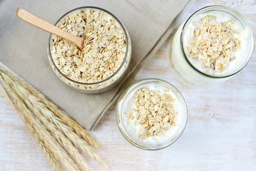 Vitamin Healthy Breakfast Yogurt with Oat Flakes White Wooden Background Porridge Glass Jar Useful Food 