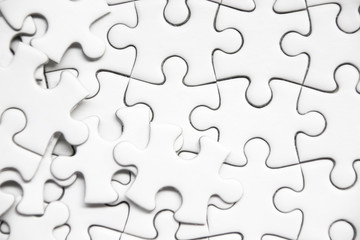 Fototapeta premium white jigsaw puzzle background.