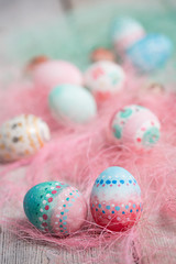 Fototapeta na wymiar Painted Easter eggs on old boards , Easter background