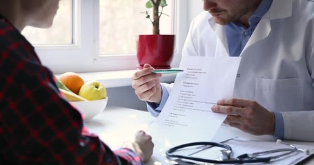nutritionist and patient discussing balanced nutrition plan in office