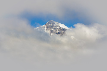 mountain peak with clouds in the frame for your text