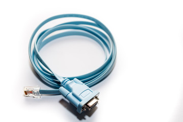 blue network cable with RJ45 connectors for conecting long distance communication closer on white background.