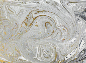Marble abstract acrylic background. Nature black marbling artwork texture. Golden glitter.