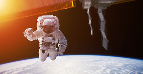 Astronaut working on a space station 3D rendering elements of this image furnished by NASA © sdecoret