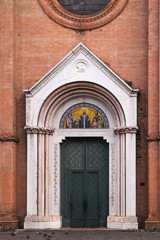 Fototapeta na wymiar Beautiful door of a church in Bologna, Italy