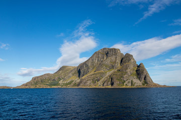 Fototapeta na wymiar Alden island in Askvoll Municipality western Norway. The island is most notable for its magnificent 460-metre tall mountain called 