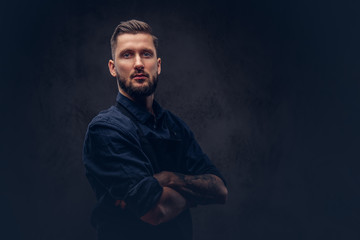 Studio portrait of a professional bearded butcher with hairstyle