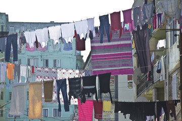 Washed laundry hanging in front of the windows of the facade in Batumi, Georgia