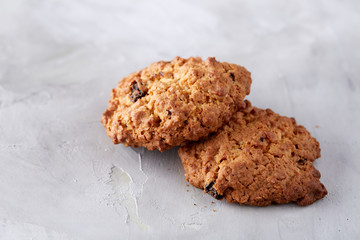 Sweet biscuits arranged in pattern on light textured background, close-up, shallow depth of field, selective focus.