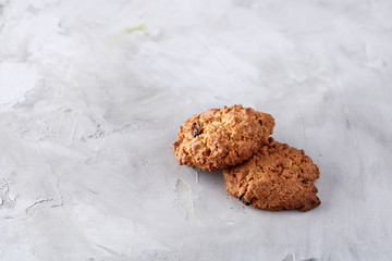Sweet biscuits arranged in pattern on light textured background, close-up, shallow depth of field, selective focus.