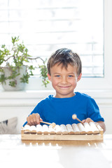 pretty boy is playing xylophone