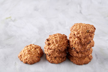 Sweet biscuits arranged in pattern on light textured background, close-up, shallow depth of field, selective focus.