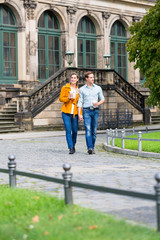 Fototapeta na wymiar Tourist couple in Dresden having walk at Zwinger with coffee