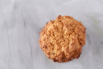 Sweet biscuits arranged in pattern on light textured background, close-up, shallow depth of field, selective focus.