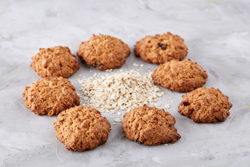 Sweet biscuits arranged in pattern on light textured background, close-up, shallow depth of field, selective focus.