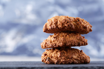 Sweet biscuits arranged in pattern on light textured background, close-up, shallow depth of field, selective focus.