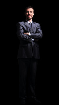Close  up portrait of a business man on black background