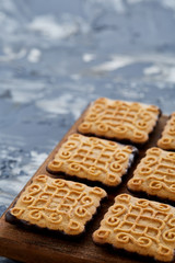 Top view close-up picture of tasty cookies on the cutting board, shallow depth of field, selective focus