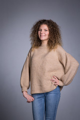  woman with curly hair, studio.