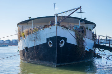 An old ship is standing in the water