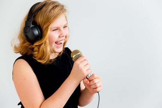 Girl singing with a microphone