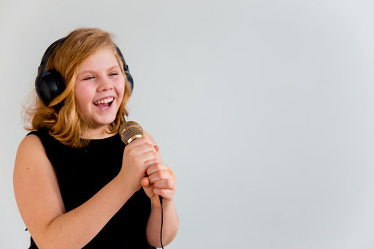 Girl singing with a microphone