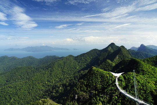 Panoramic view of Sky Bridge and Cable Car with mountains sea and tropical forests in the background Langkawi island, Malaysia. Langkawi SkyCab is one of the major attractions in the island