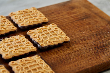 Top view close-up picture of tasty cookies on the cutting board, shallow depth of field, selective focus