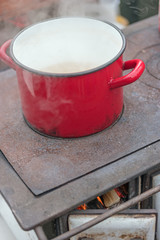 cooking dish on retro wood fueled stove