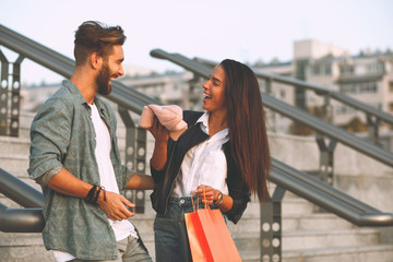 Young happy couple  have fun after shopping in the city