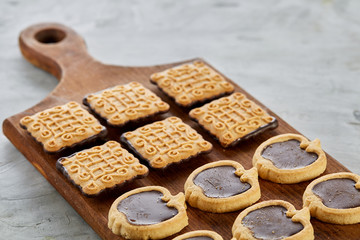 Top view close-up picture of tasty cookies on the cutting board, shallow depth of field, selective focus