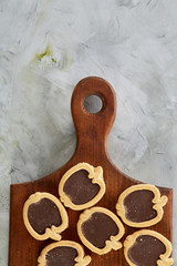 Top view close-up picture of tasty cookies on the cutting board, shallow depth of field, selective focus